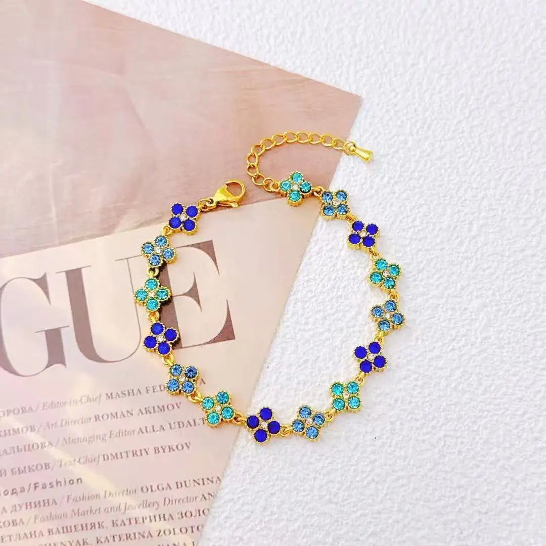 Bracelet acier doré fleurs cristaux lumineux
