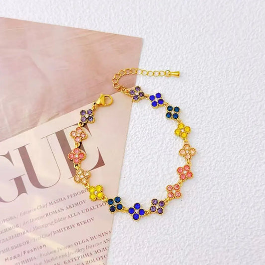 Bracelet acier doré fleurs cristaux lumineux